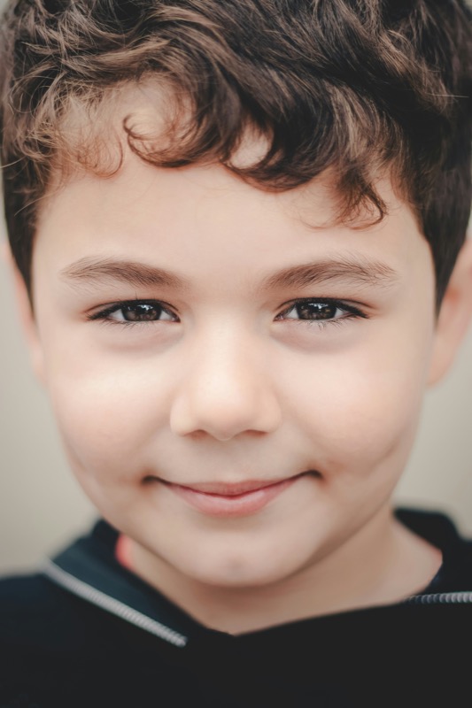 Close-up portrait of a child with clear face, natural expression, and even lighting, ideal for a personalized book